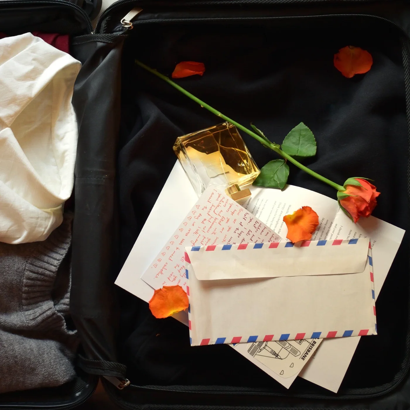 Cover of Make You Miss Me by Abner: an open suitcase with letters and a red rose